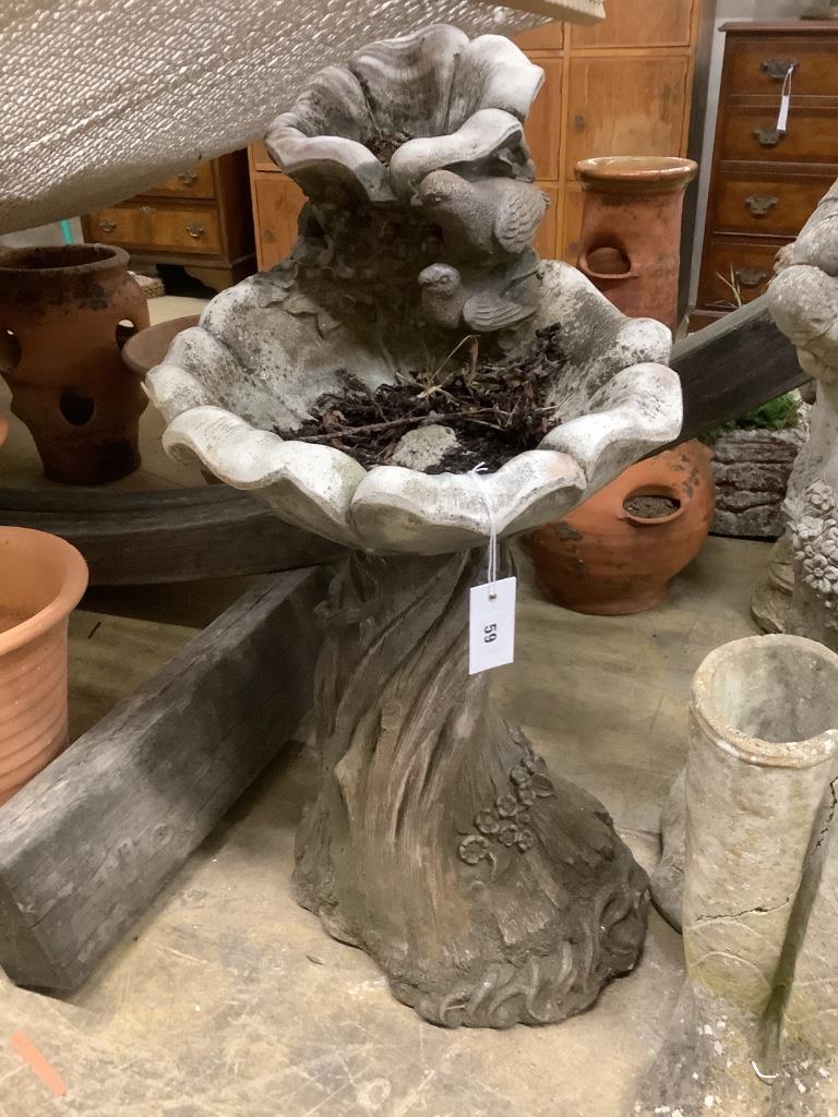 A reconstituted stone garden bird bath, width 42cm, height 90cm